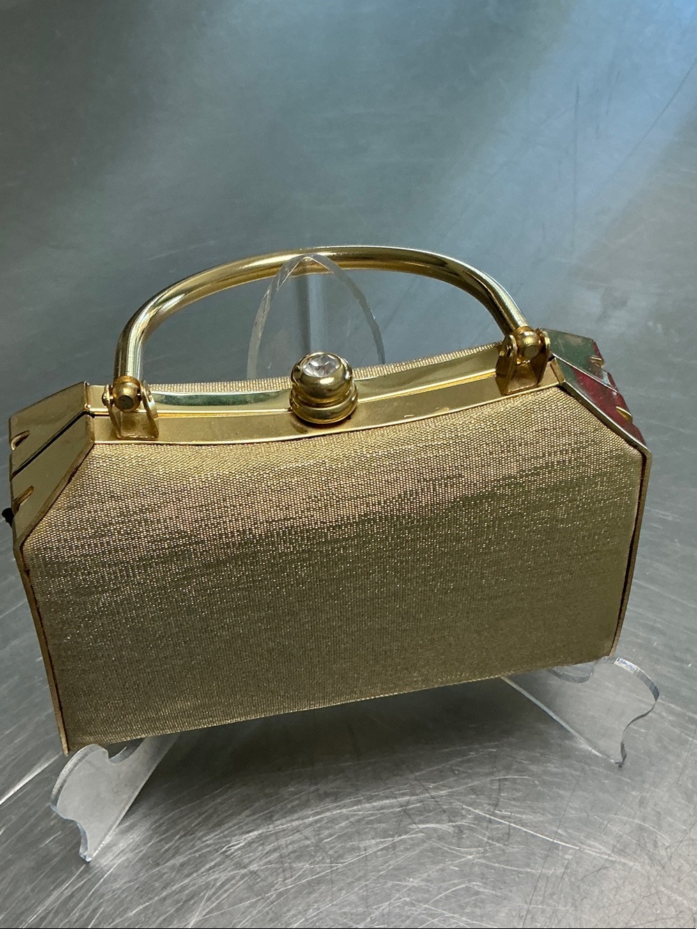 Gold Hardshell evening bag. Gold fabric with shiny gold hardware.